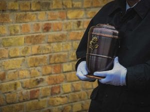 Funeral Director Giving Ashes to Algordanza for Cremation Diamond