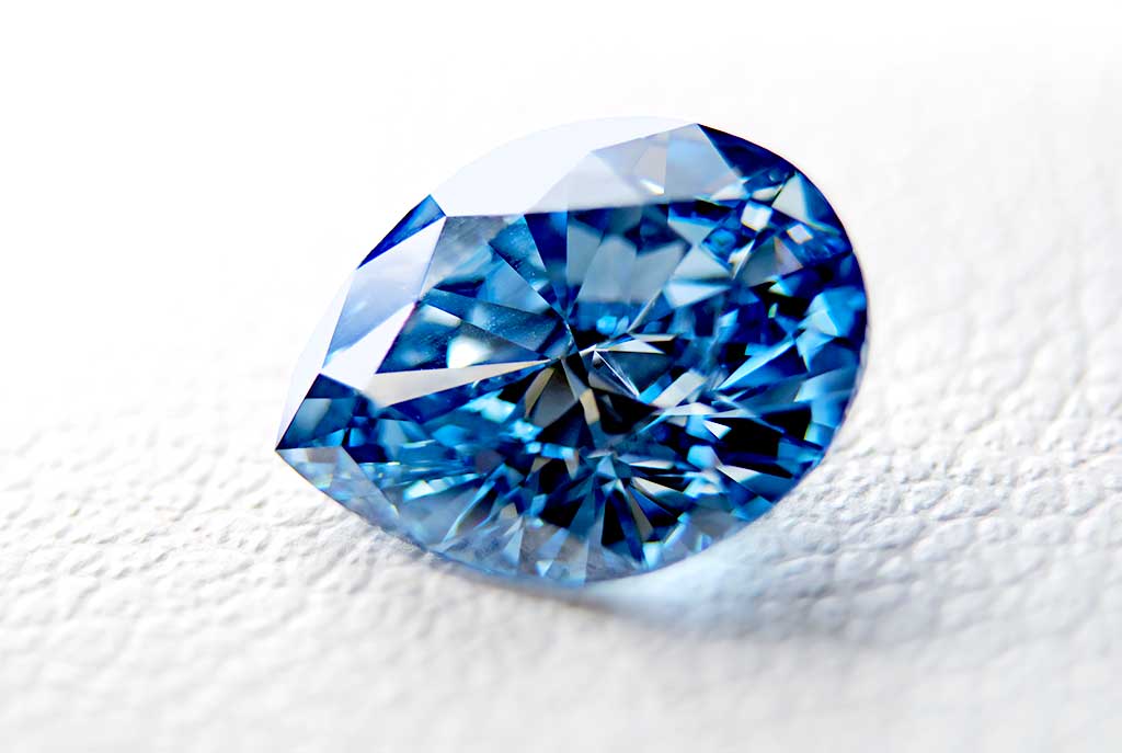 Pear cut diamond from ashes darker blue cremation diamond