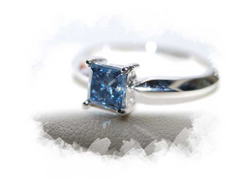 Princess cut ash diamond set into white gold ring